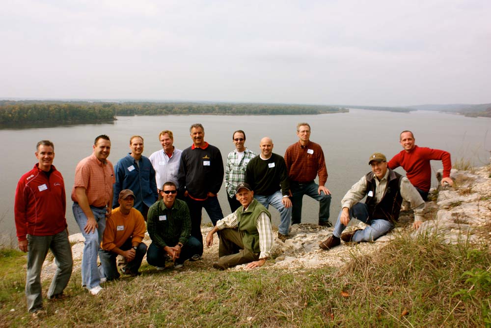 Group photo of Legacy Builders on the bluff overlooking a large river