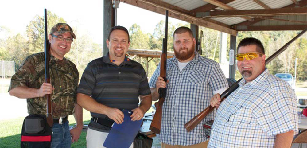Four Legacy Builders men at the fall retreat gun shoot